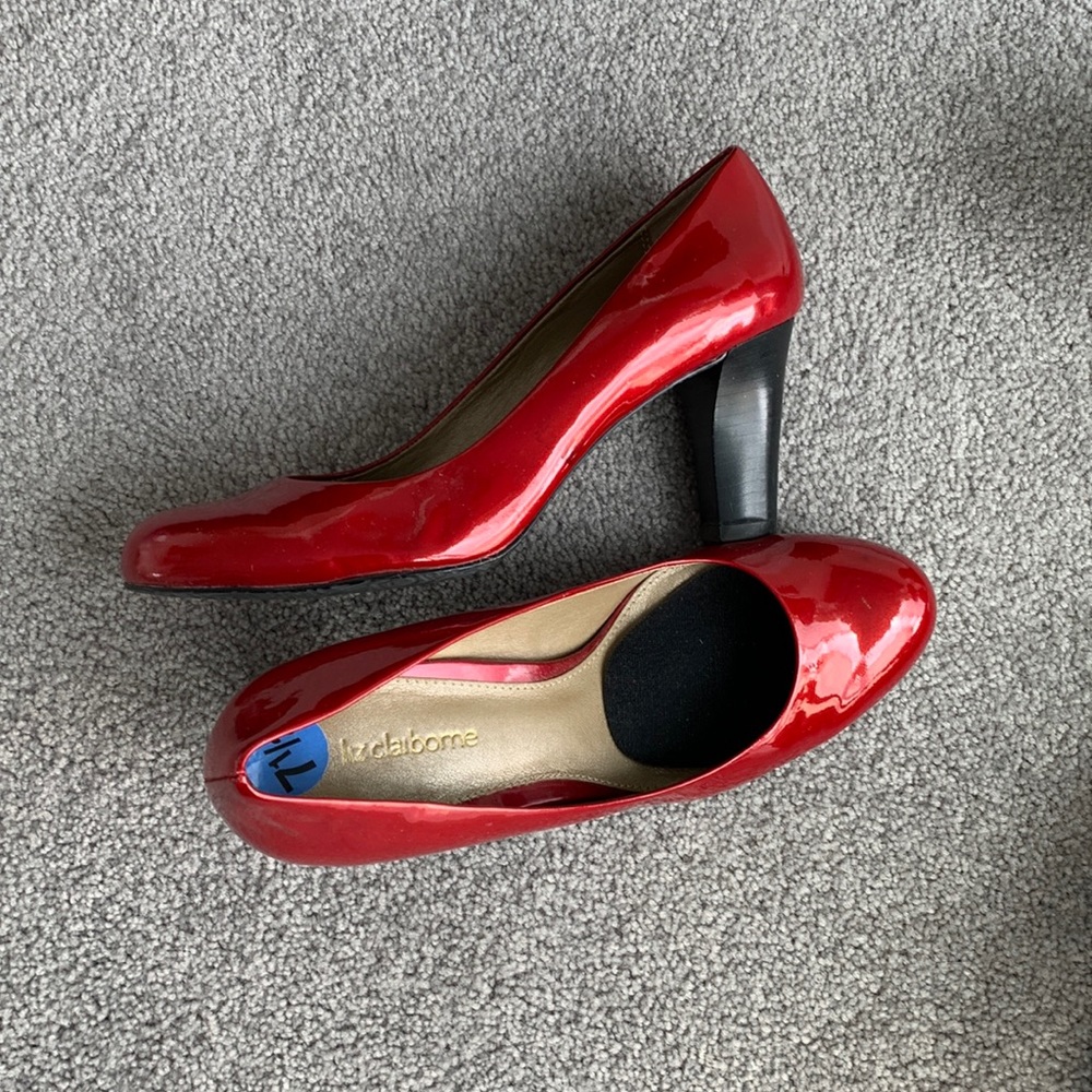 Red patent leather pumps with black heel